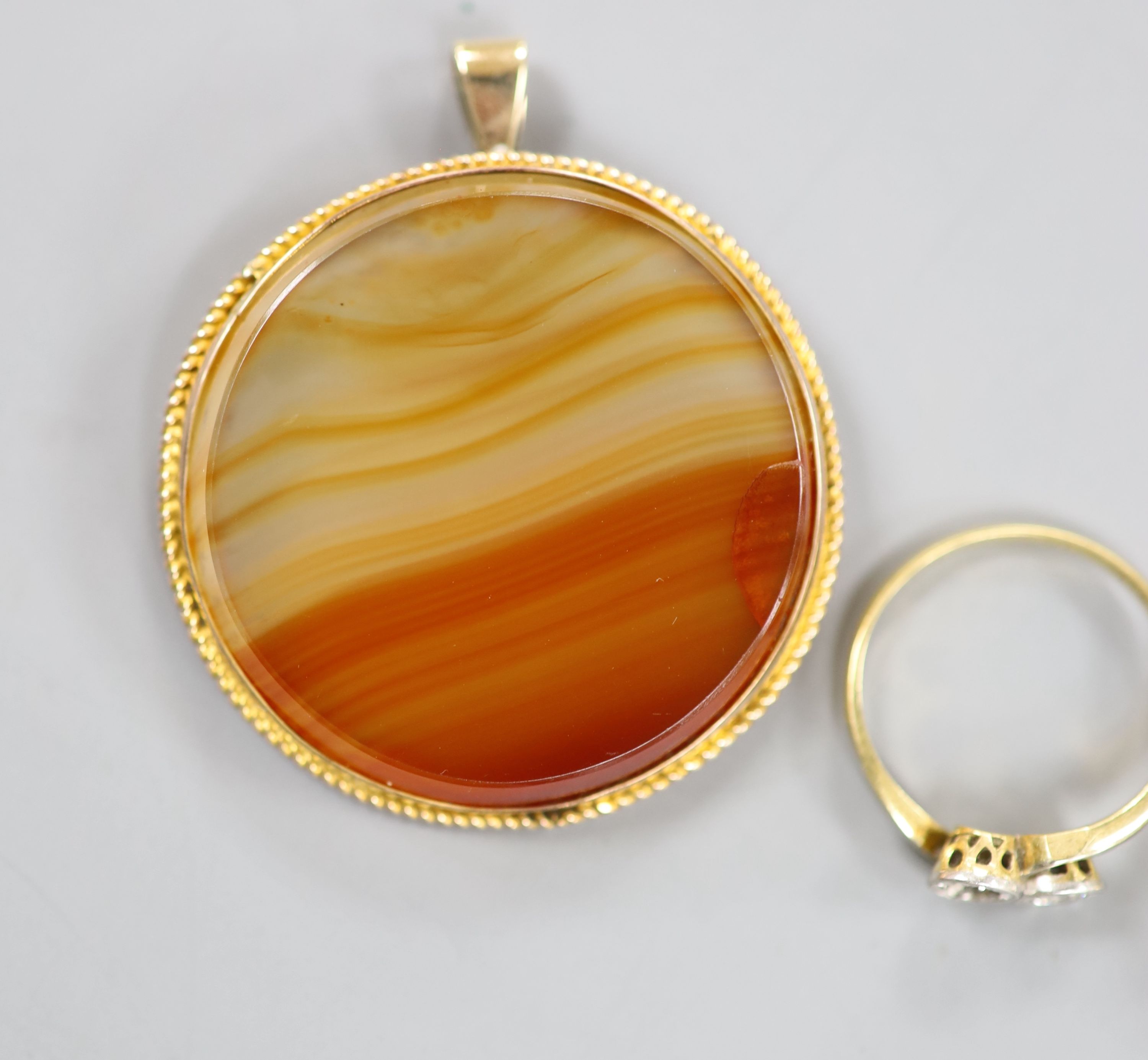 Two 18ct and gem set rings including diamond crossover(stone missing) and sapphire and diamond (stone missing), three similar 9ct rings, two yellow metal rings and a 9ct mounted agate pendant